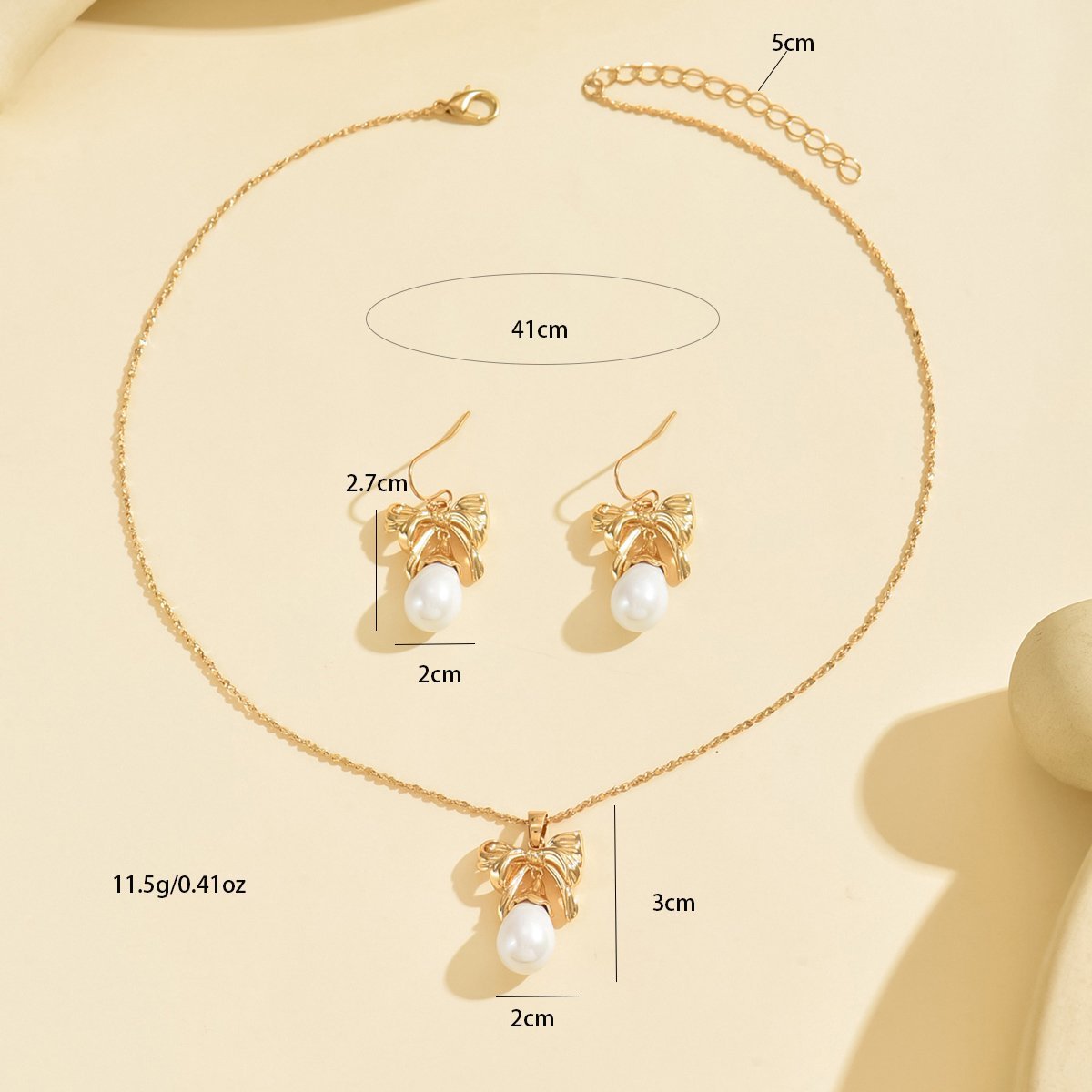 Elegant Gold-Toned Bow & Pearl Jewelry Set - Necklace & Earrings - Image 5